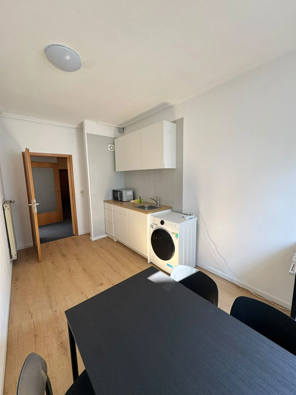 Kitchen area with assembled furniture at a project stage